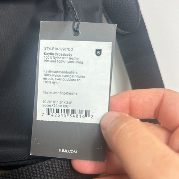 TUMI Kaylin Crossbody Nylon with leather fabric strap and leather strap. - Picture 2 of 9